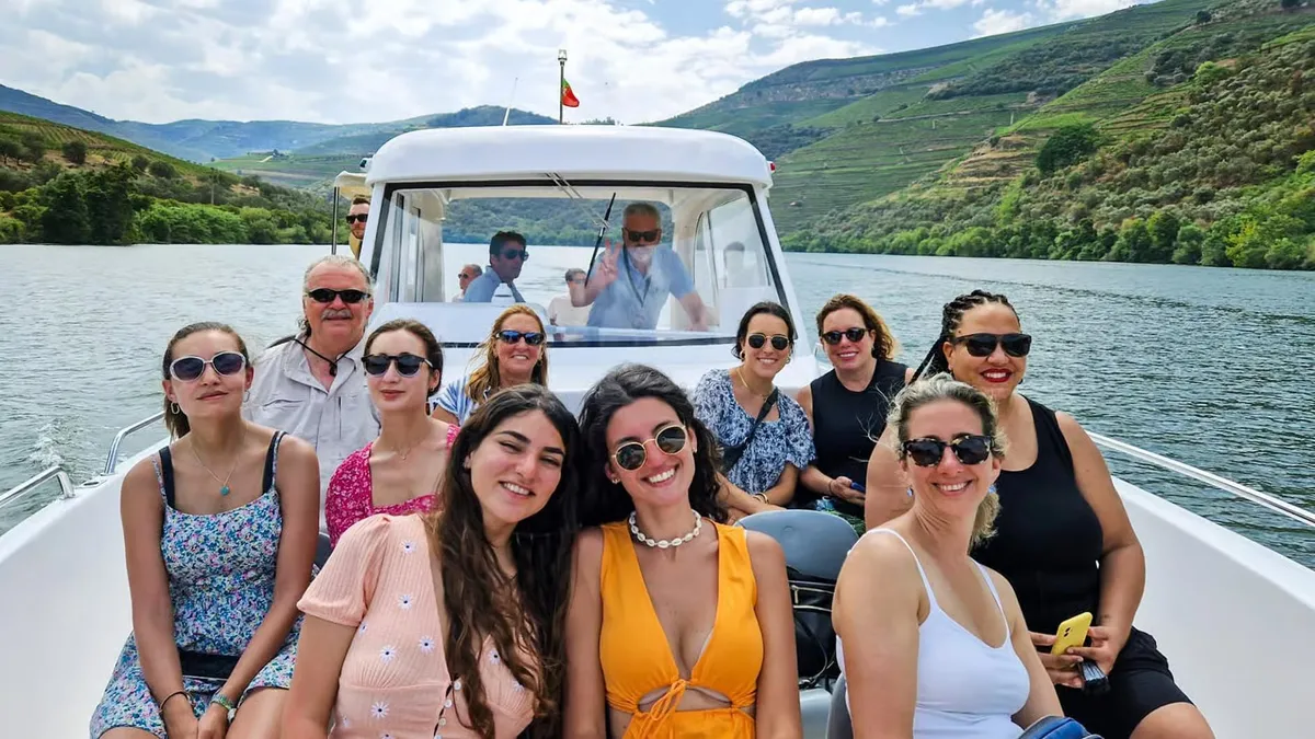 Terraced vineyards falling to the Douro River near Pinhão on the most-booked Douro Valley wine tour from Porto with boat cruise and lunch